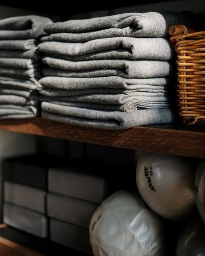 Balanced rocks on a shelf in a yoga studio
