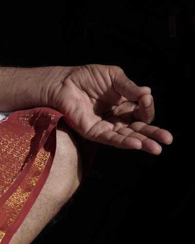 Close up of a person's hands in a mudra position