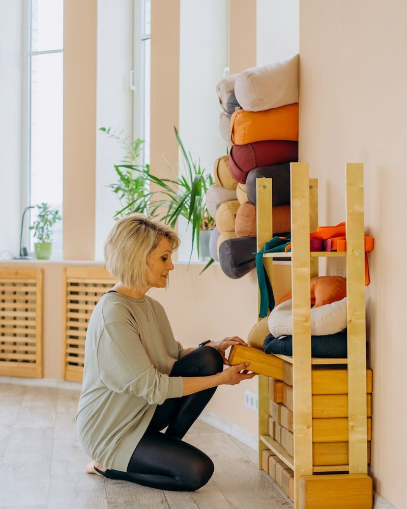 Minimalist yoga studio with warm lighting and wooden elements
