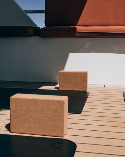 Yoga equipment including a mat and a wooden block